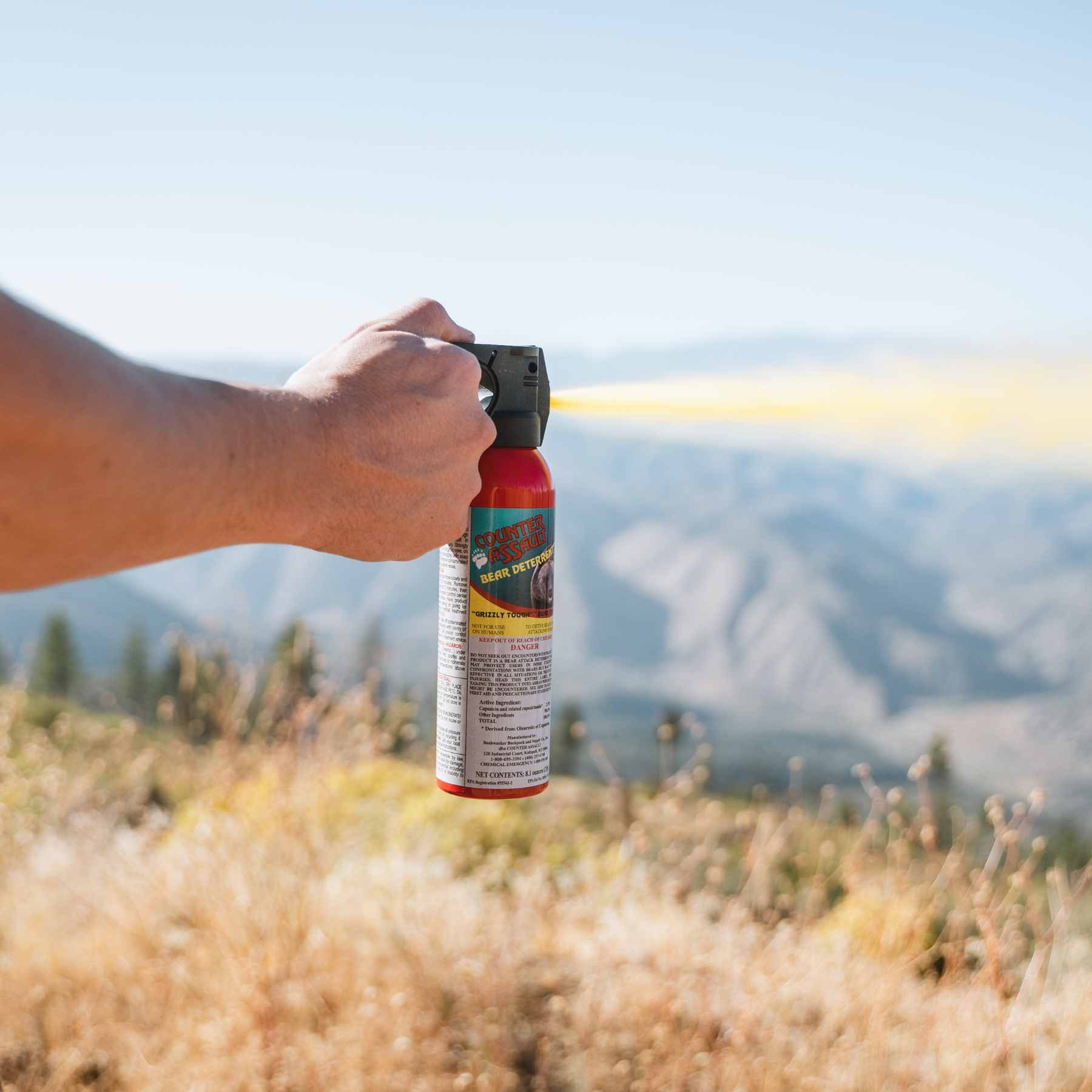 Man spraying with Counter Assault bear deterrent spray