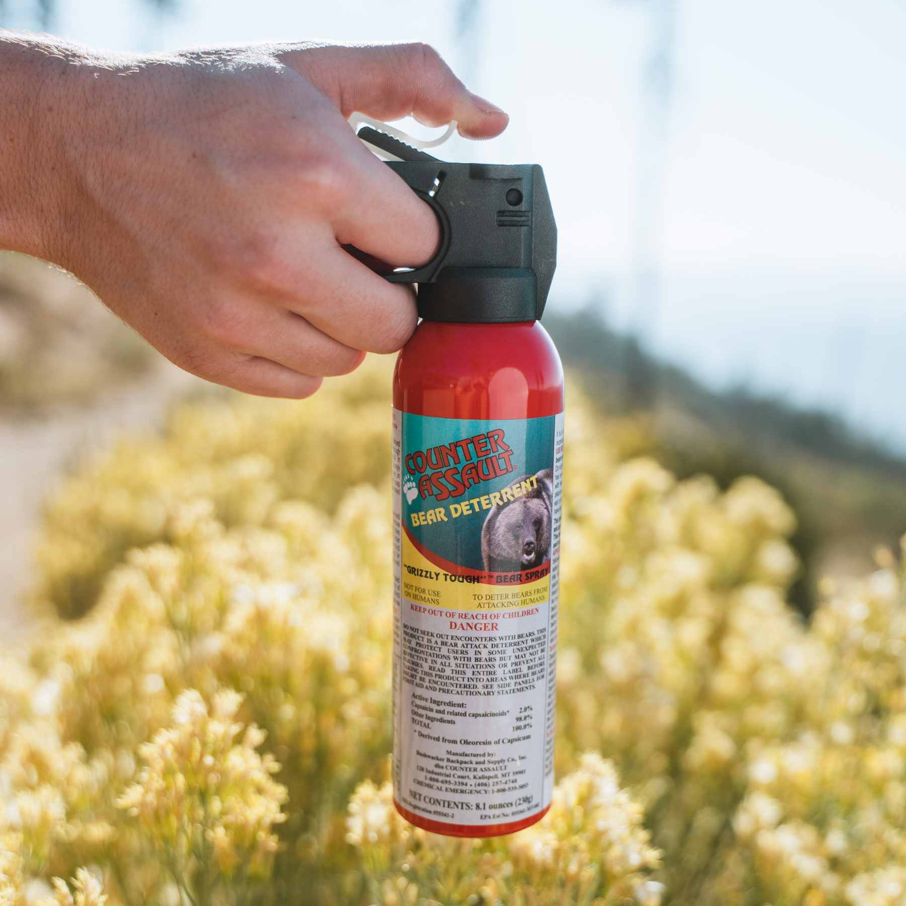 Man holding a Counter Assault bear deterrent spray