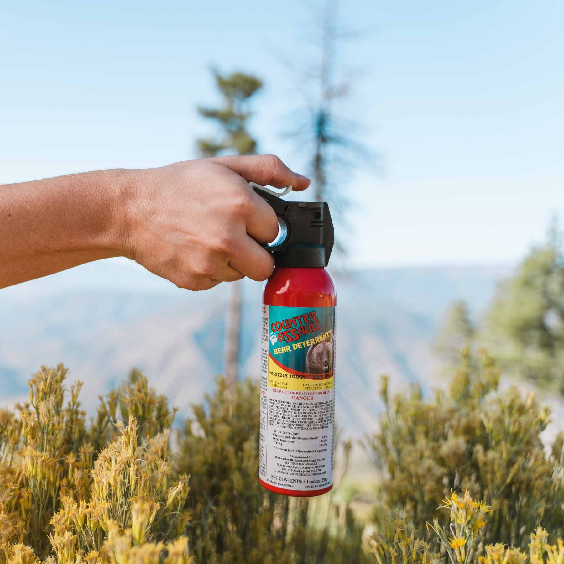 Man holding a Counter Assault bear deterrent spray