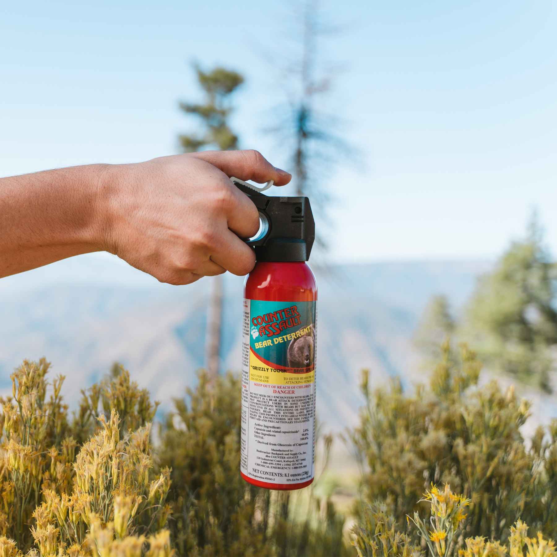 Man holding a Counter Assault bear deterrent spray