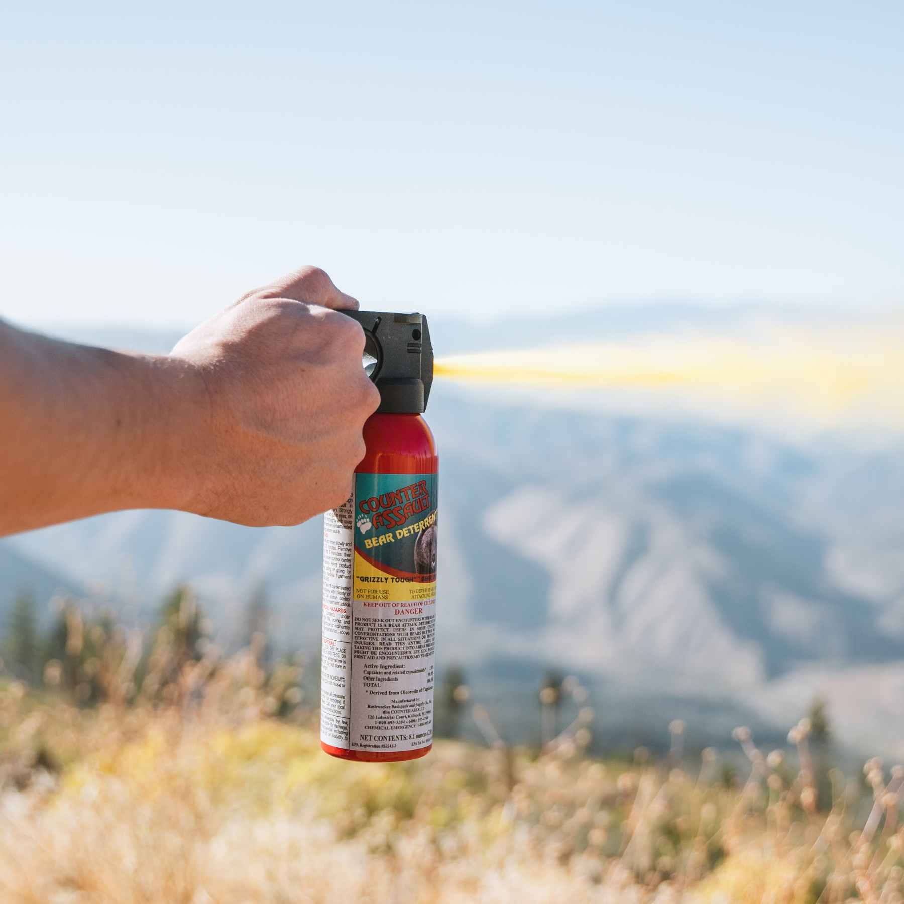 Man spraying with a Counter Assault bear deterrent spray