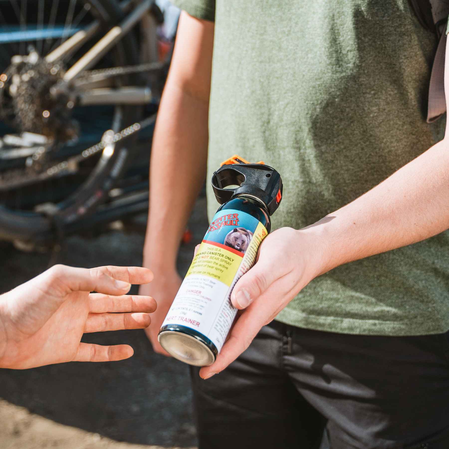 Man handing a training canister