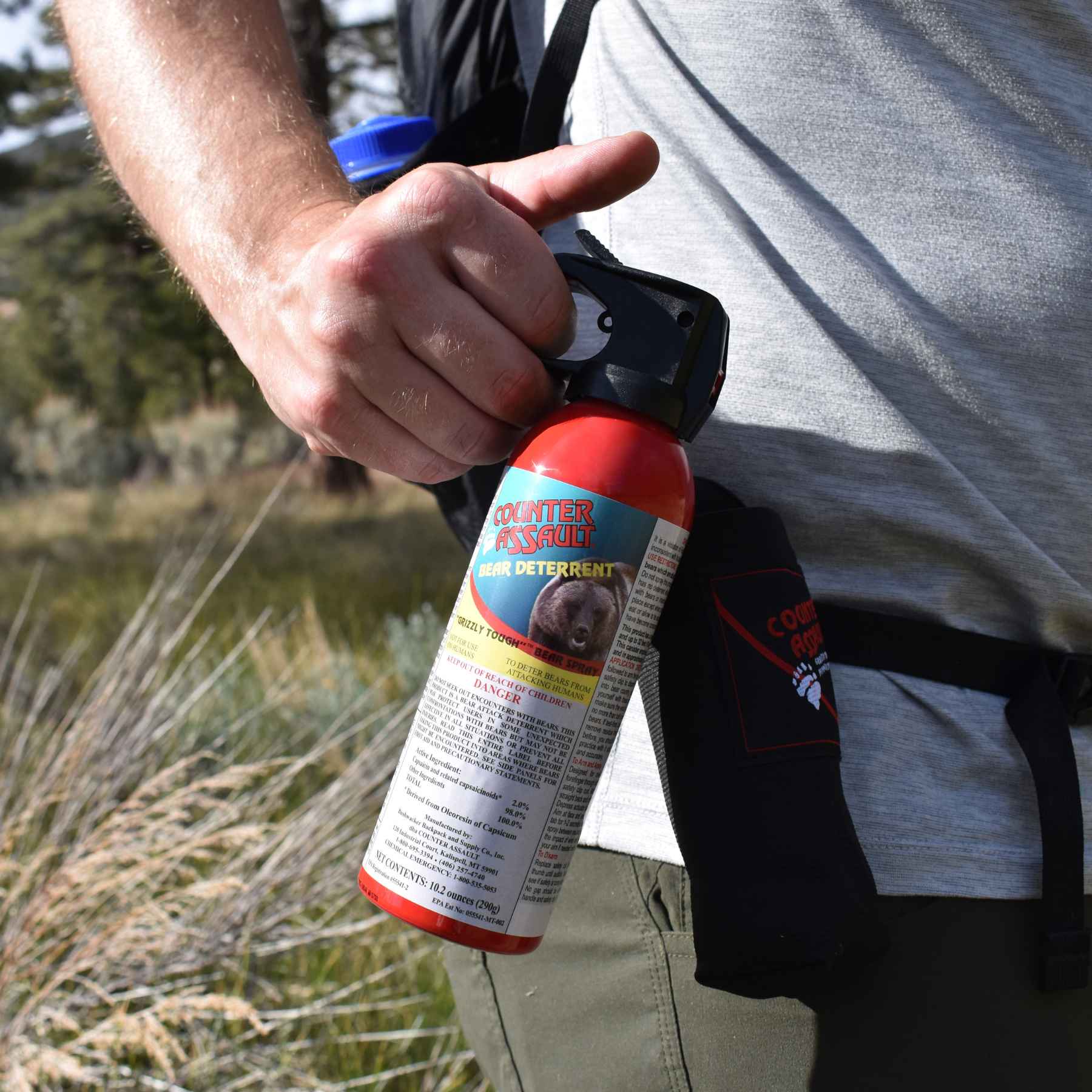 Man holding a Counter Assault bear deterrent spray