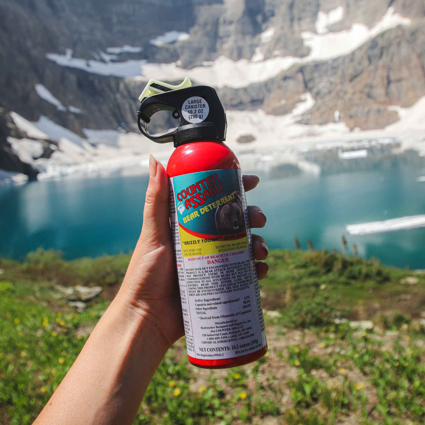 Woman holding a Counter Assault bear deterrent spray