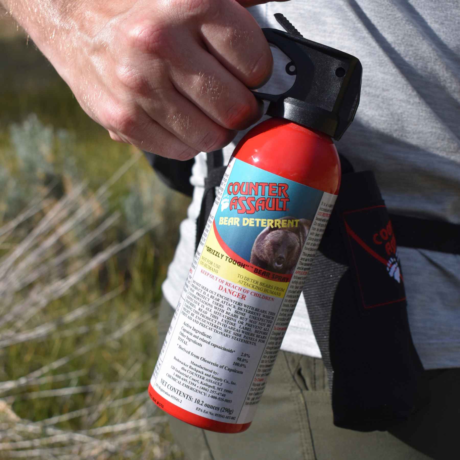 Man holding a Counter Assault bear deterrent spray