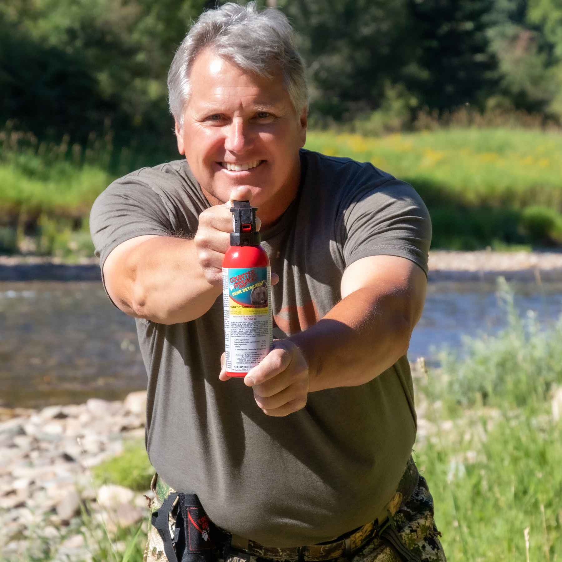 Man using the Counter Assault bear deterrent spray