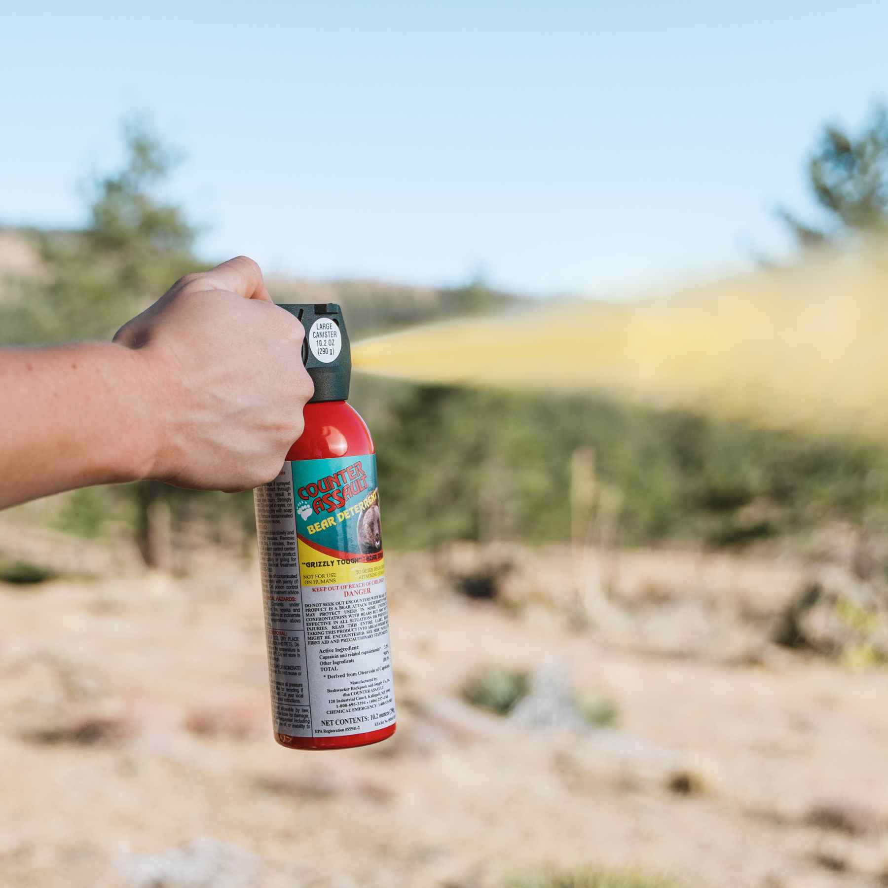 Woman spraying with Counter Assault bear deterrent spray