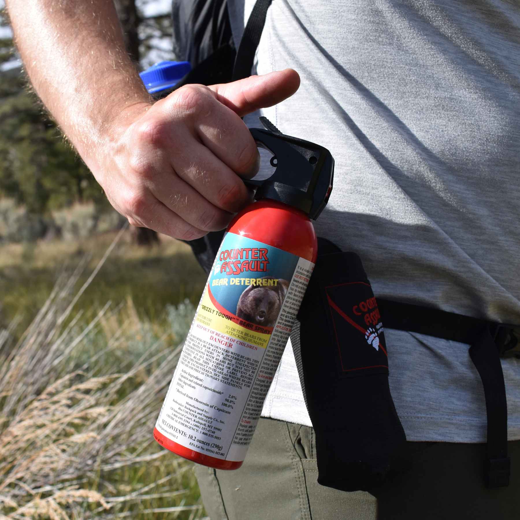 Man holding a Counter Assault bear deterrent spray