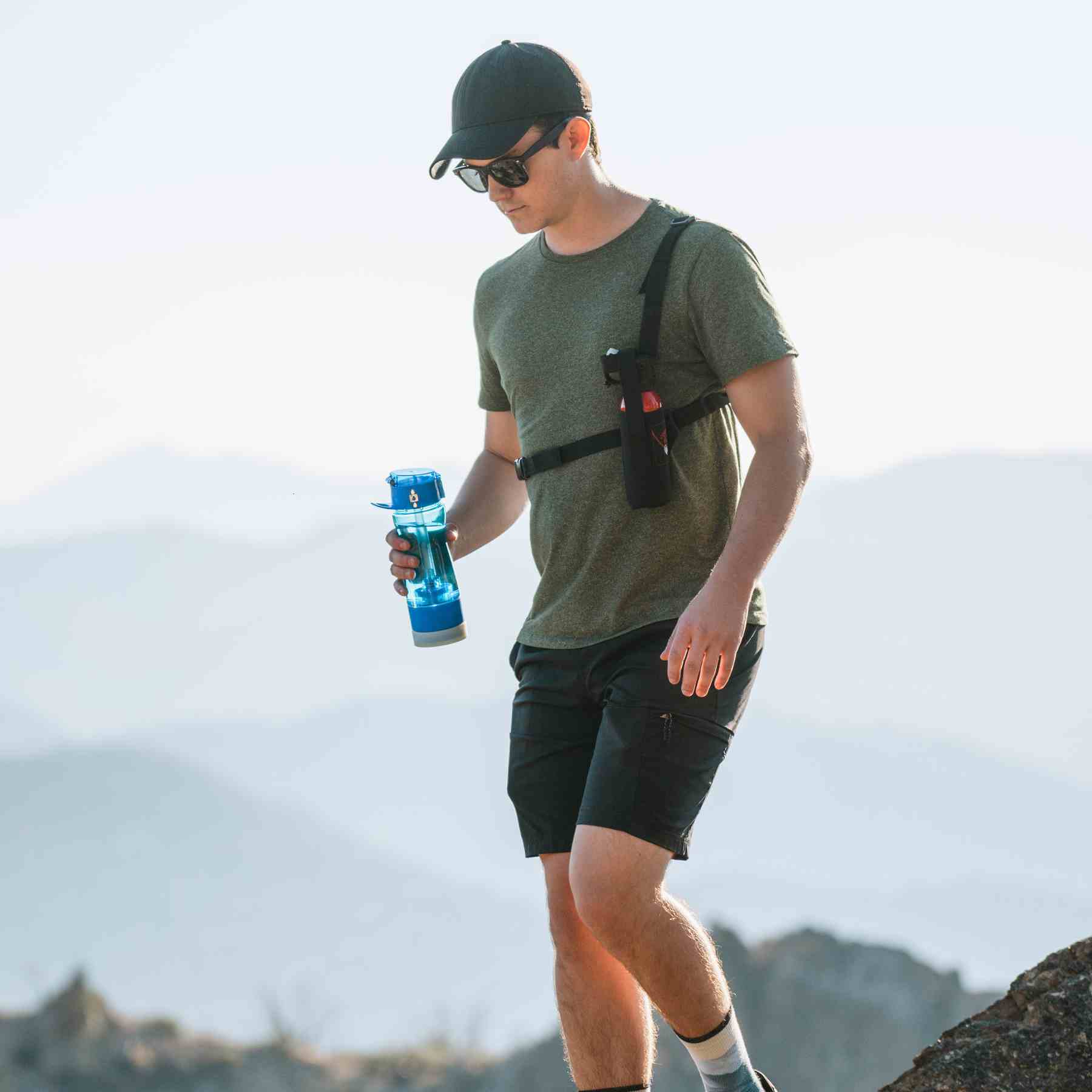 Man with a holster for Counter Assault bear deterrent spray