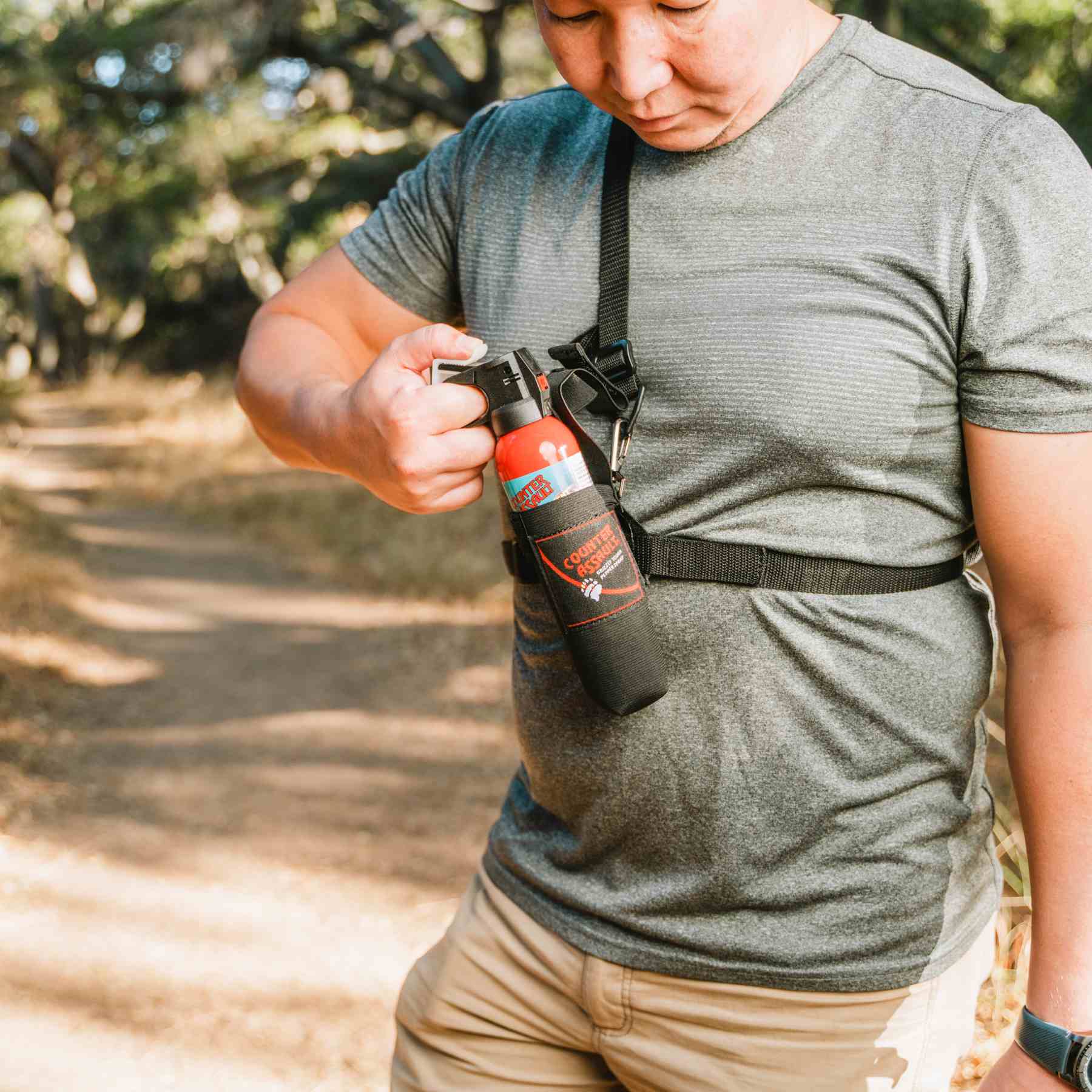 Man with a holster for Counter Assault bear deterrent spray