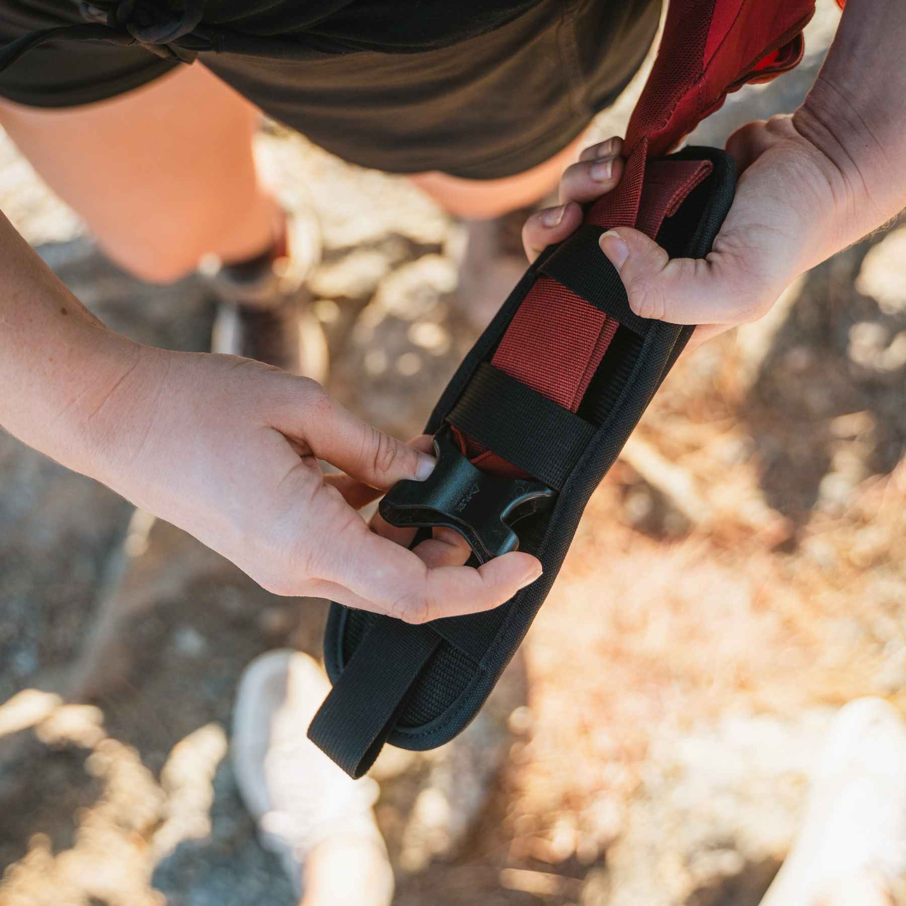 Woman attaching the holster to a bag