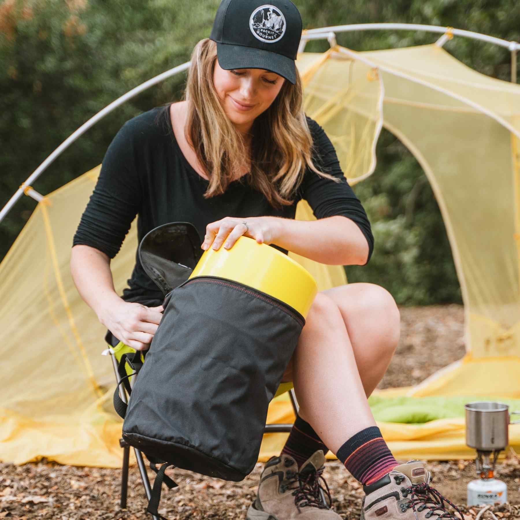 Woman putting a keg to the carrying case