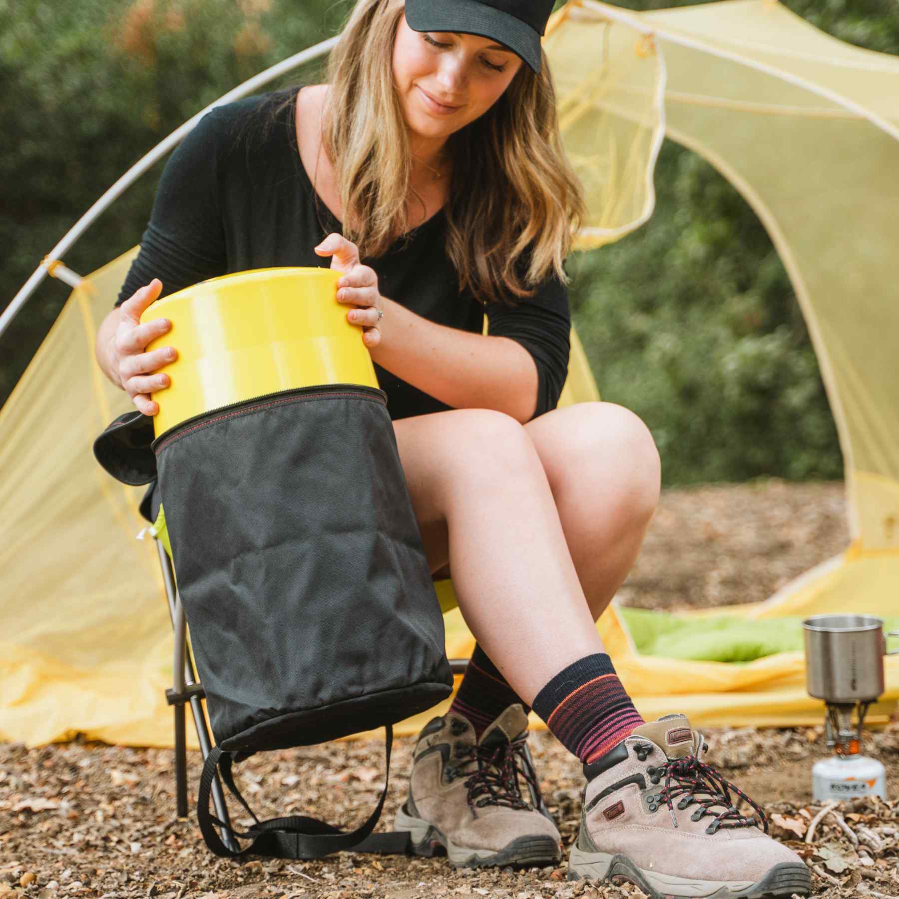 Woman putting a keg to the carrying case