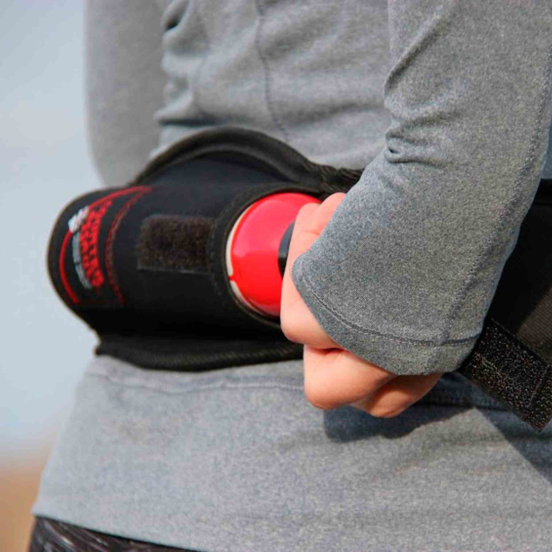 Woman with a trail runner holster attached