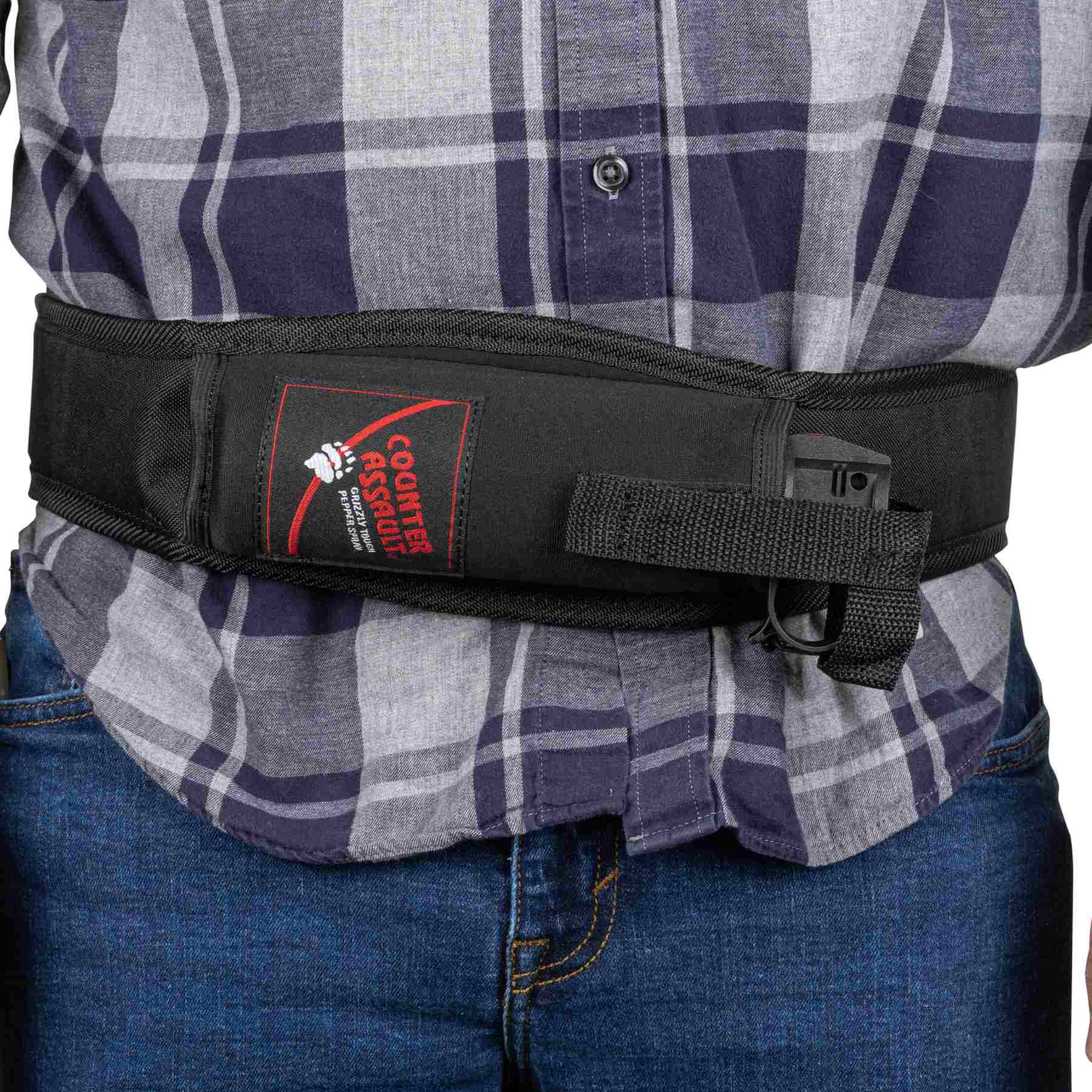 Man with a trail runner holster attached