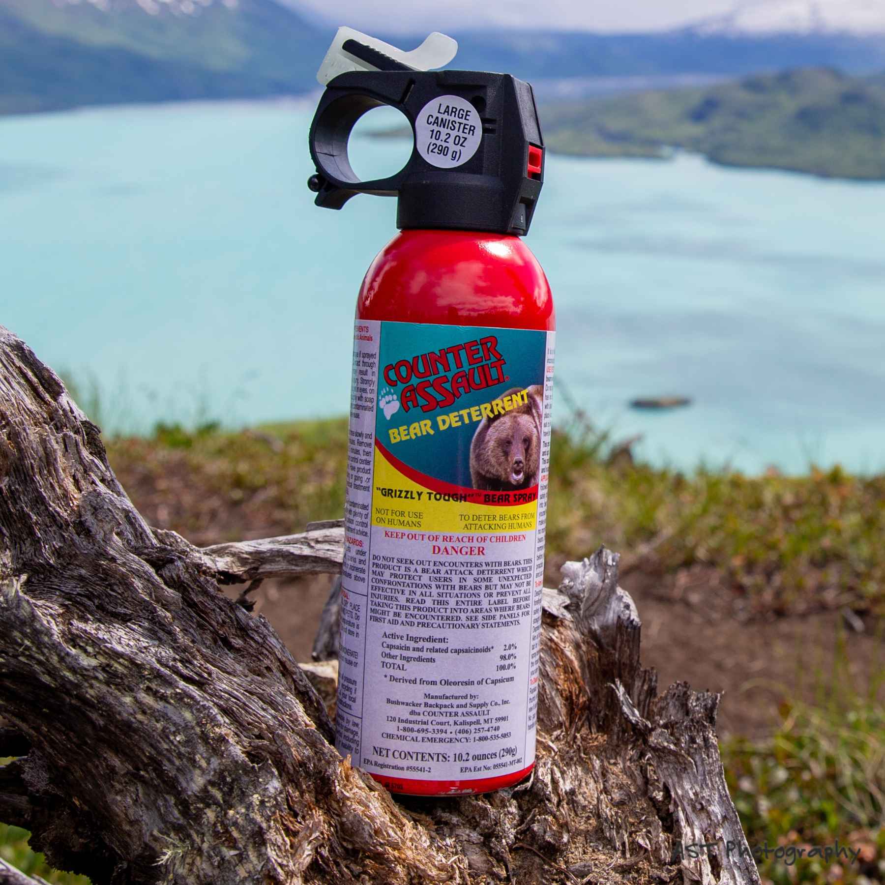 Counter Assault bear deterrent spray placed on a tree