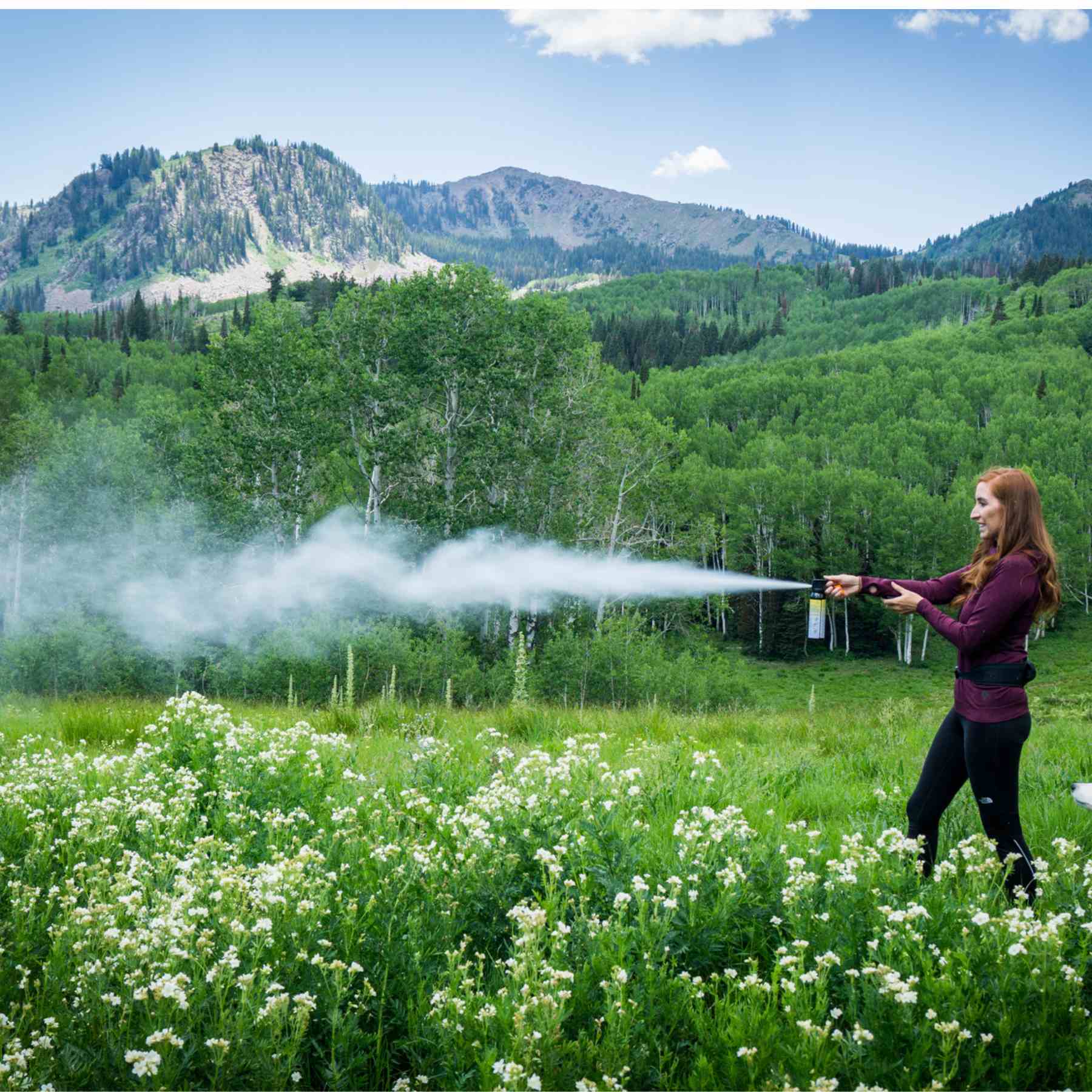 Woman spraying with a training canister