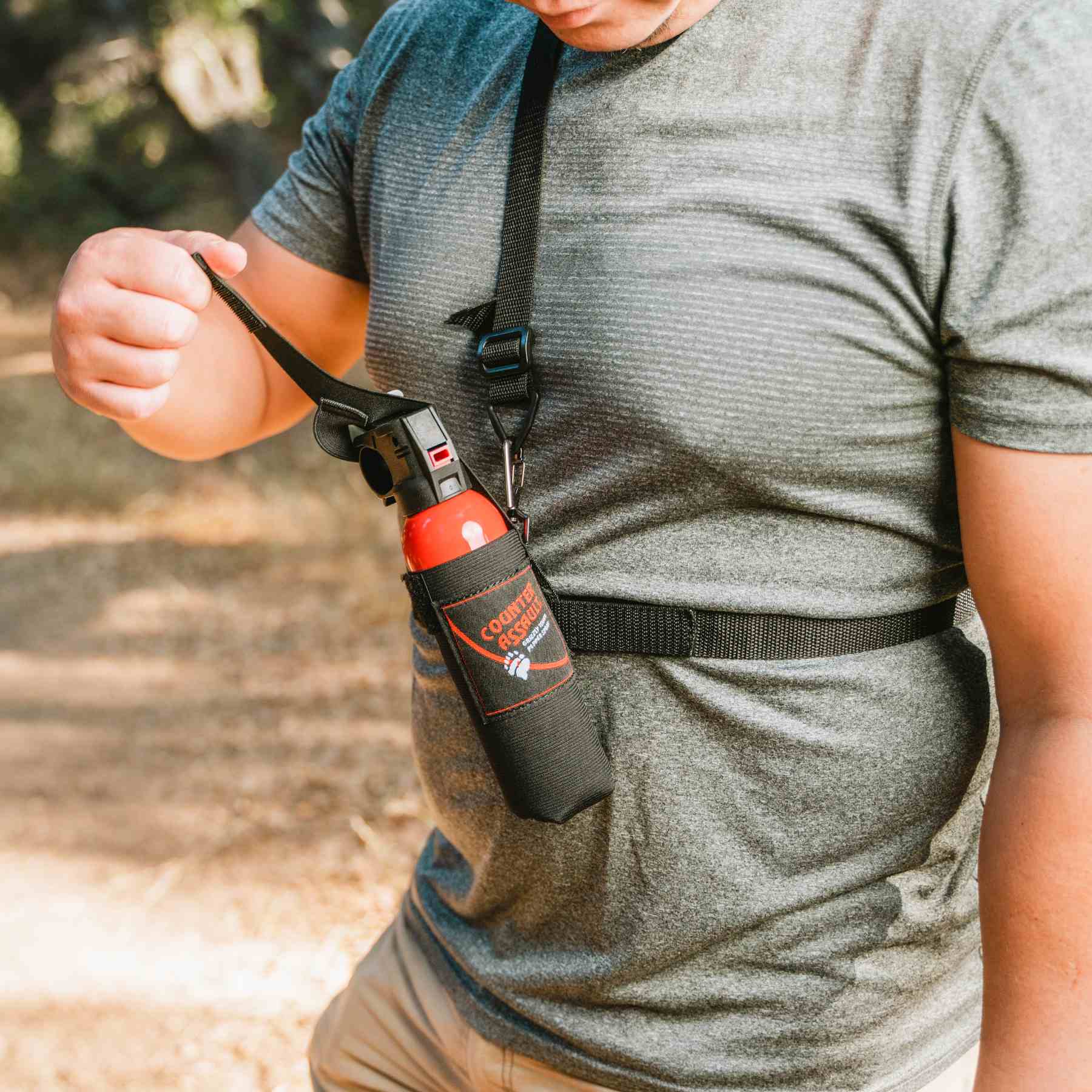 Man with a 3 in 1 holster for bear spray