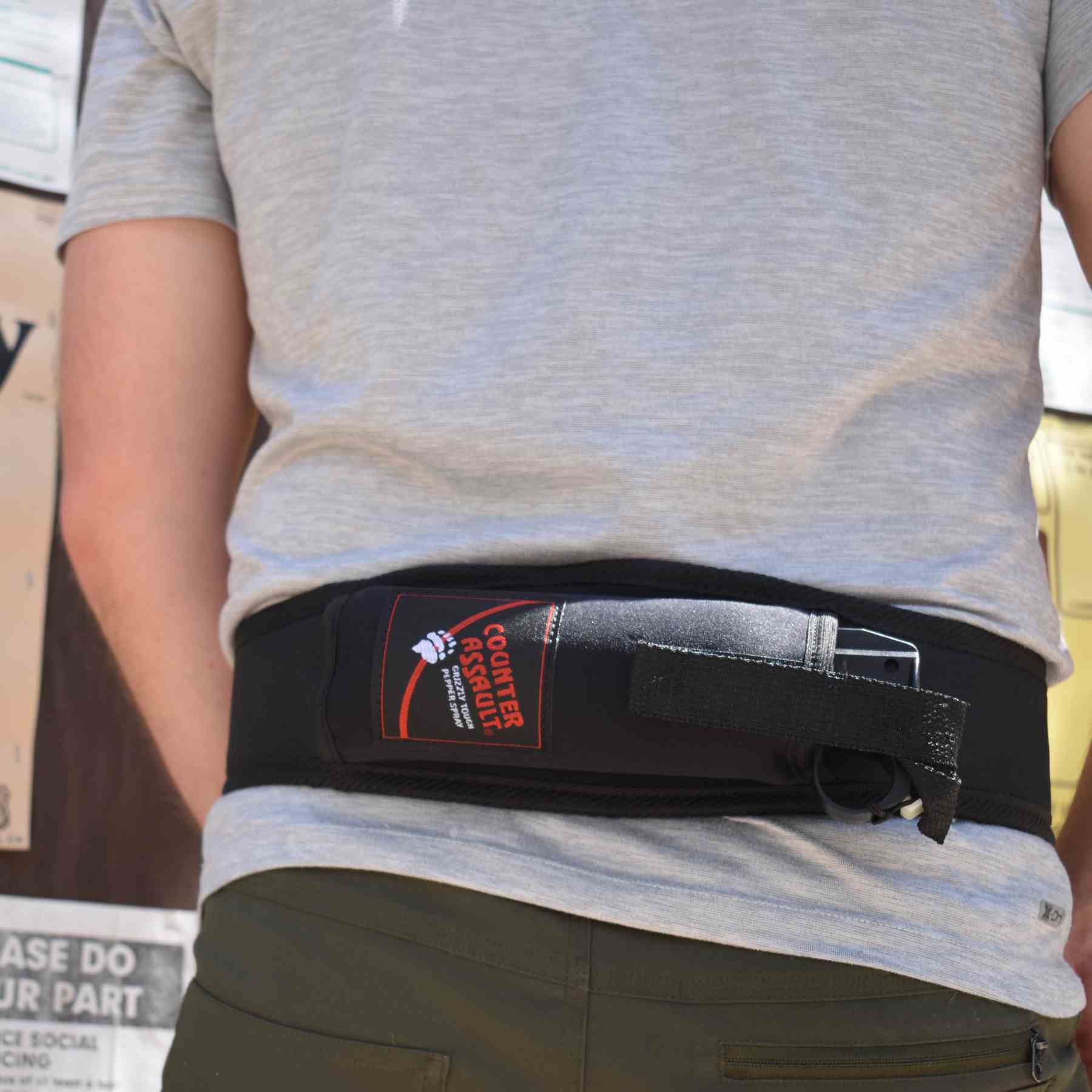 Man with a trail runner holster attached