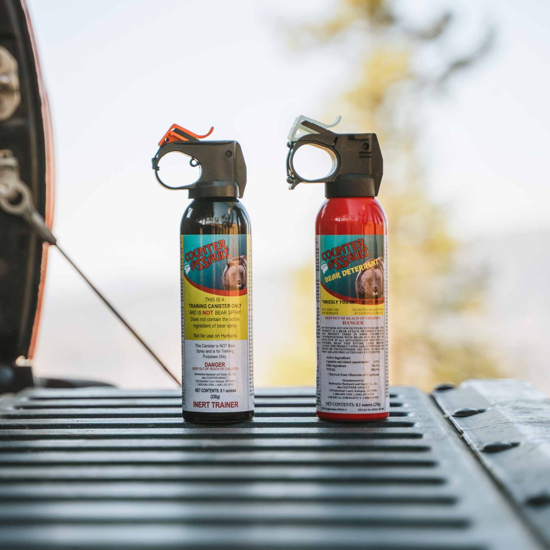 8.1 oz bear spray and training canister on back of truck